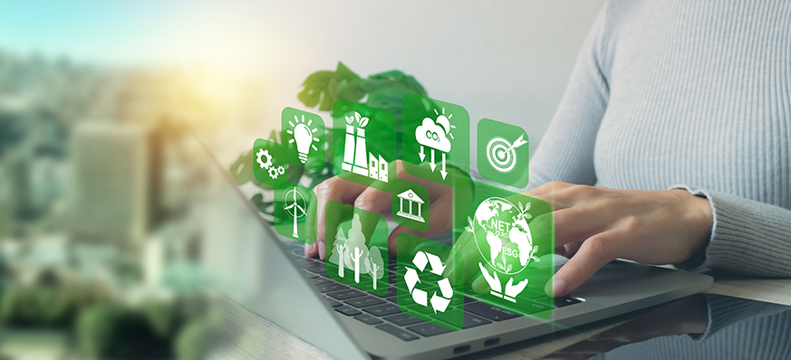 Sustainable technology icons over laptop keyboard