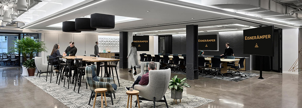 Modern open-plan office with meeting area.