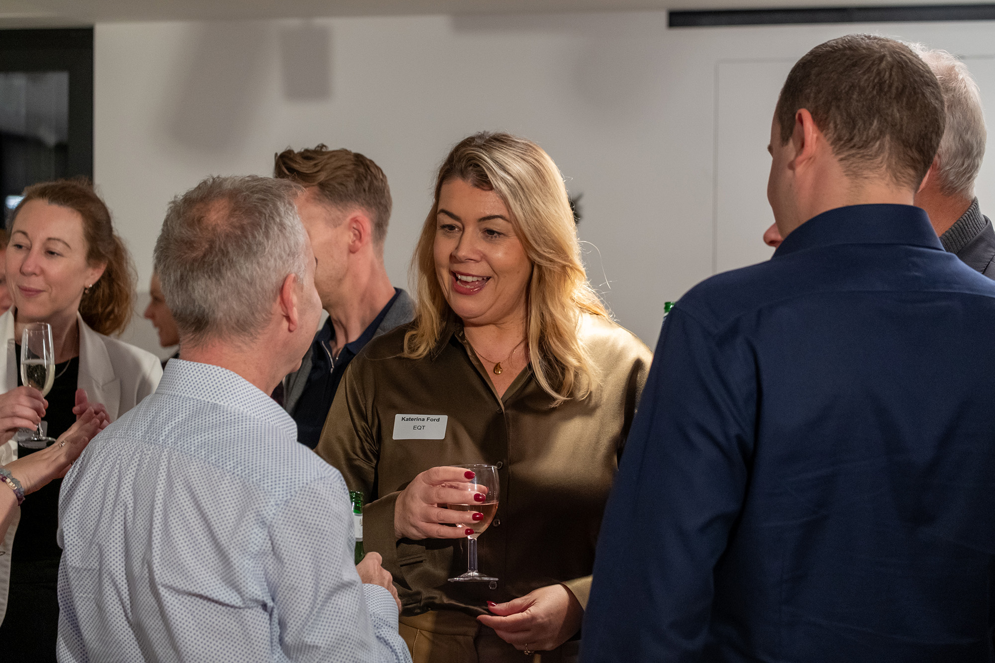 People networking at a social event