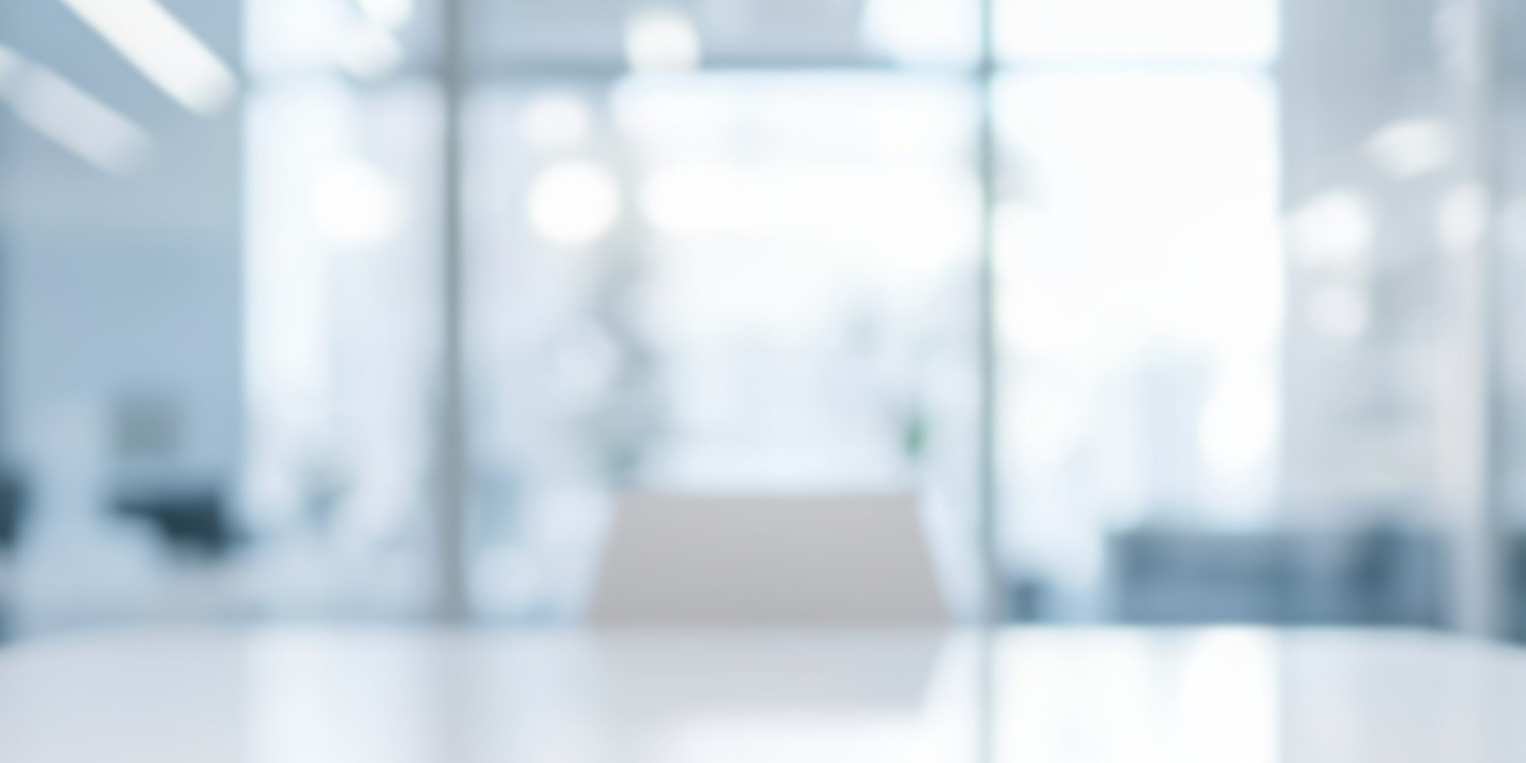 a,blurred,office,space,featuring,a,modern,,bright,design.